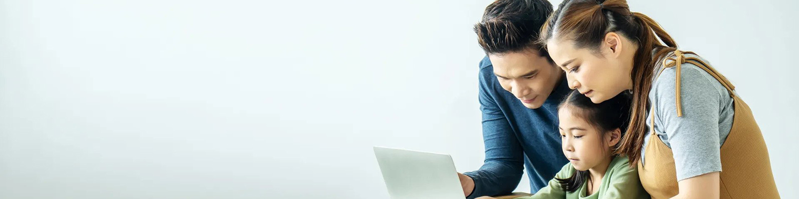 family looking at laptop