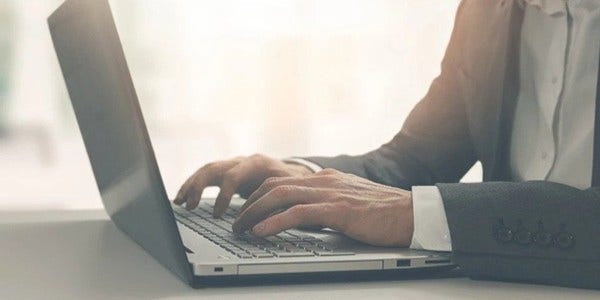 Young businessman working on laptop