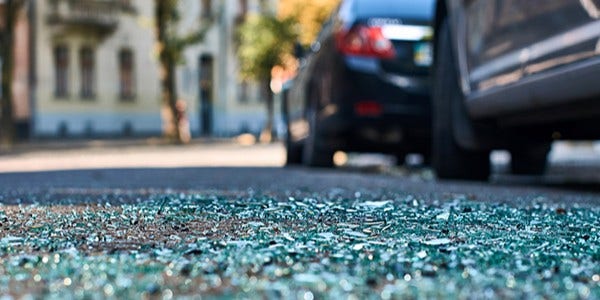 Car accident with broken glass on the floor
