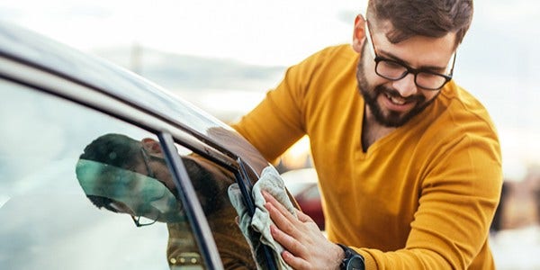 Man cleaning his car